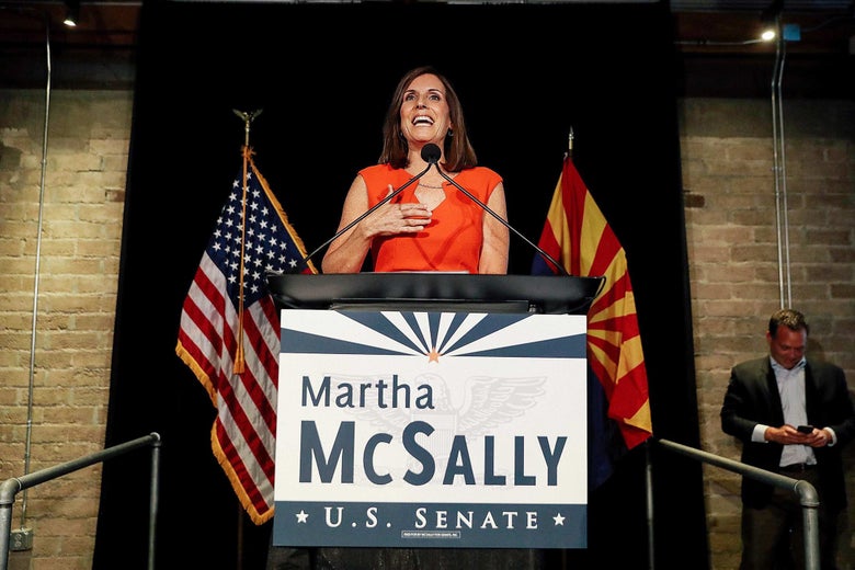 Martha McSally speaks from behind a podium that says "Martha McSally U.S. Senate."
